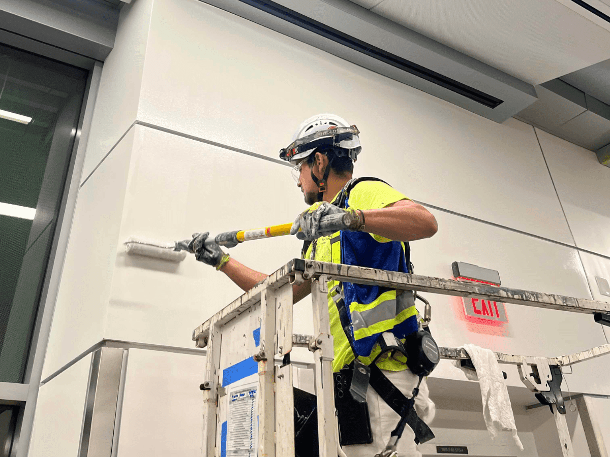 On Site with Socium: A Day in the Life of a Superintendent - A team member painting a wall
