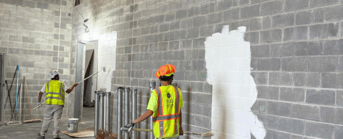 What It Means to Be a Certified Minority Business Enterprise (MBE) - our team painting a facility