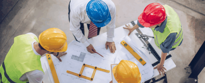 Questions to Ask Before Choosing a Coatings Partner - Partners in Construction Site Discussing