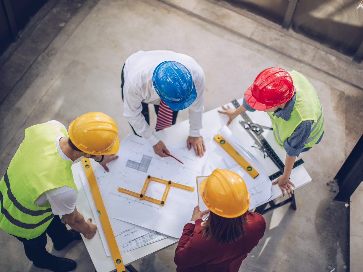 Questions to Ask Before Choosing a Coatings Partner - Partners in Construction Site Discussing