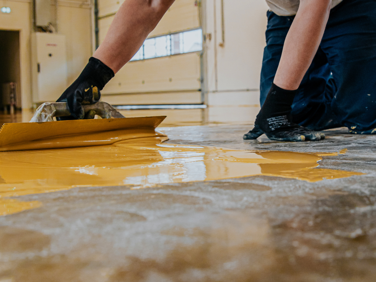 Industrial Floor Coatings: Balancing Durability and Safety - Floor Coating Being Applied