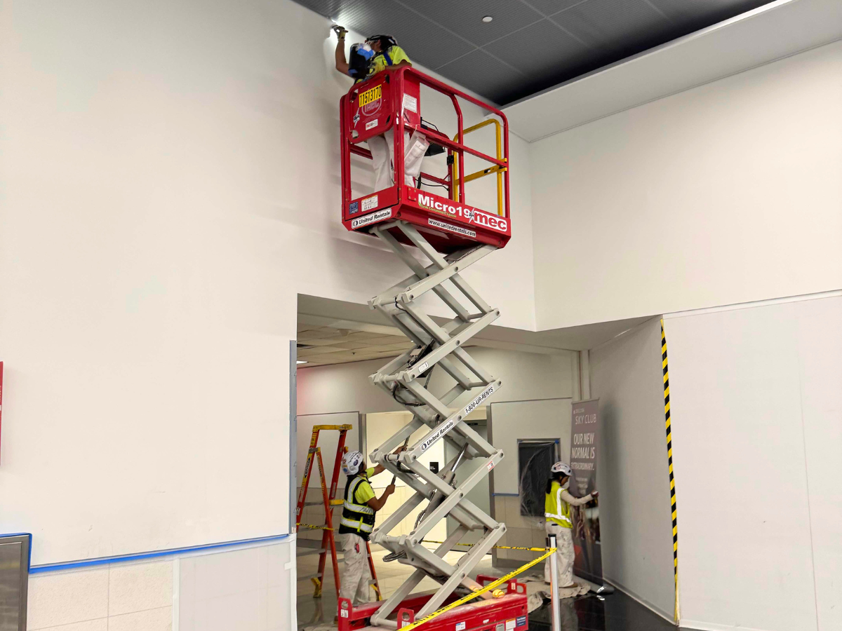 How We Cultivate Accountability Across All Job Roles - Teamof painters doinge their work at the airport