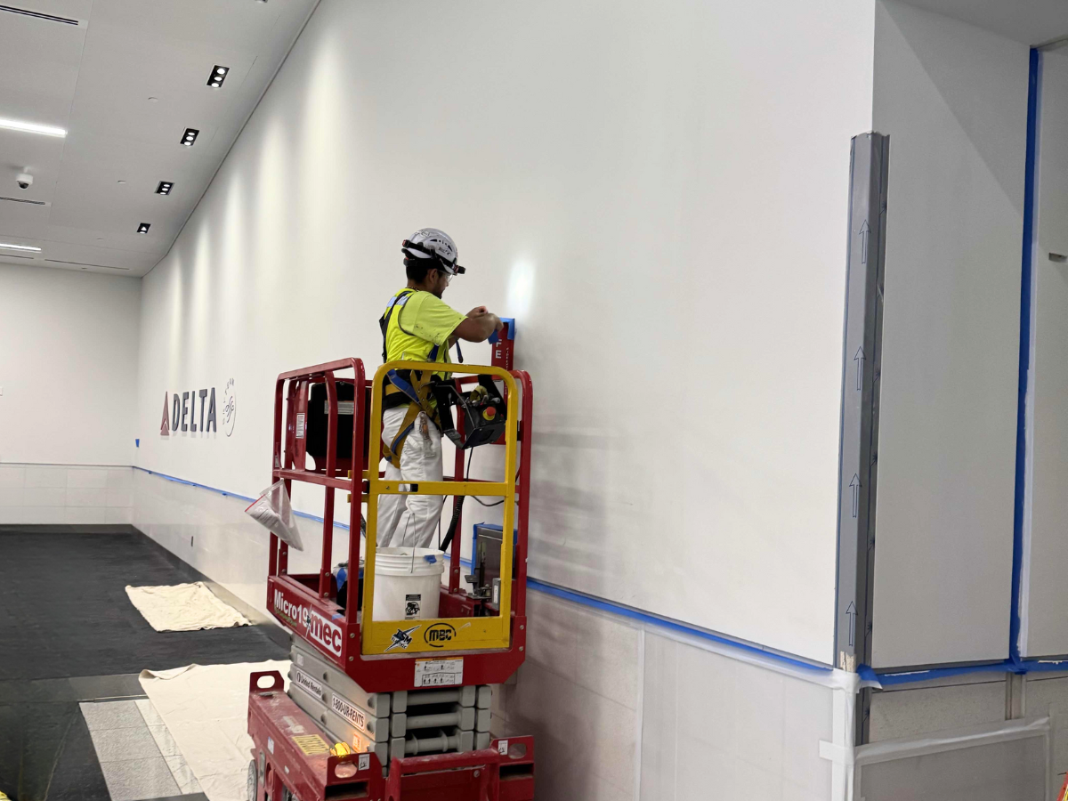 Specialty Coatings for U.S. Aviation Hangars and Terminals - Socium Coatings painter at the Hartsfield-Jackson Atlanta International Airport