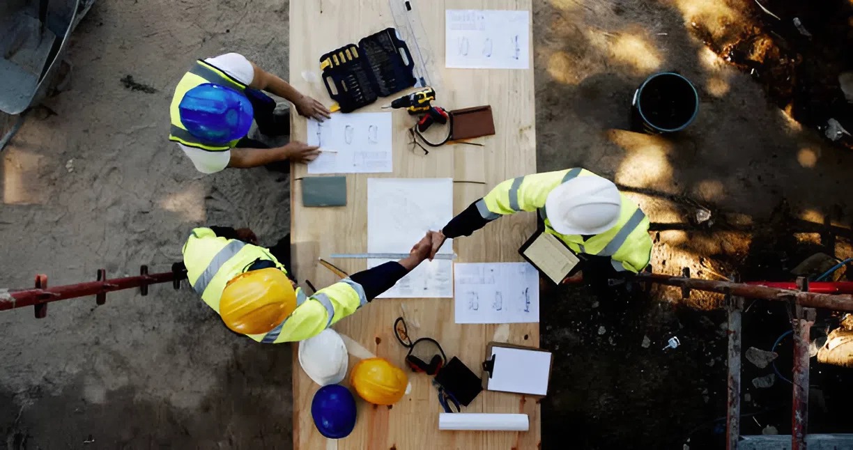 Construction workers coordinating at a job site