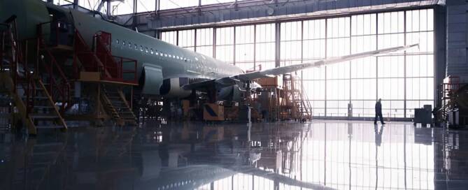 Large maintenance facility with polished floors, illustrating durable aviation hangar coatings