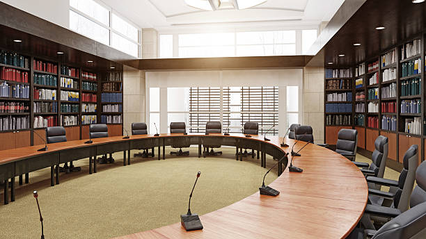 Federal office interior painted in neutrals with bookshelves covering the walls