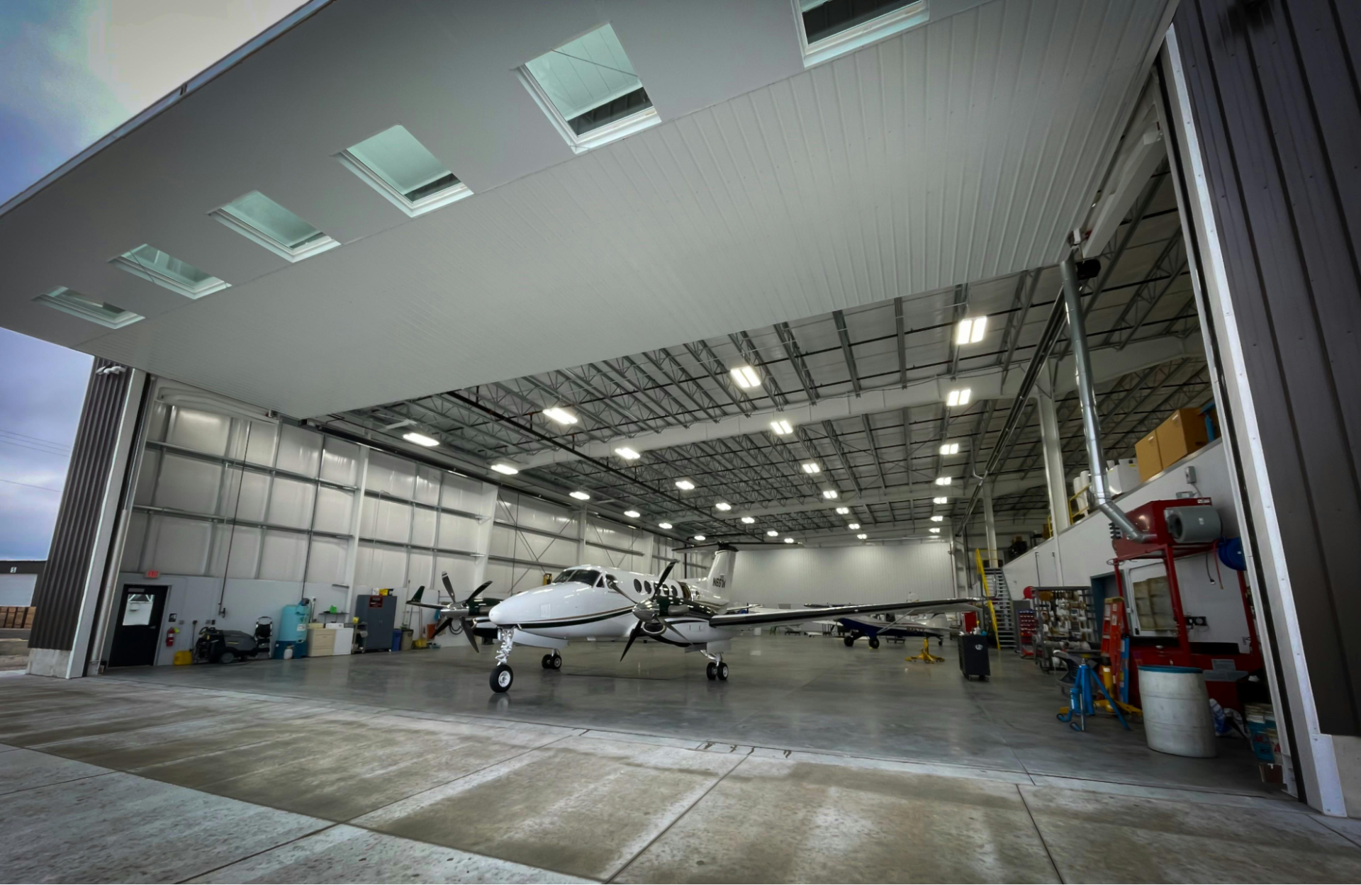 Modern aviation hangar featuring coated interior surfaces
