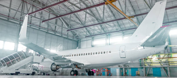 Airport hangar with coated flooring and structural surfaces protected by advanced aviation surface coatings