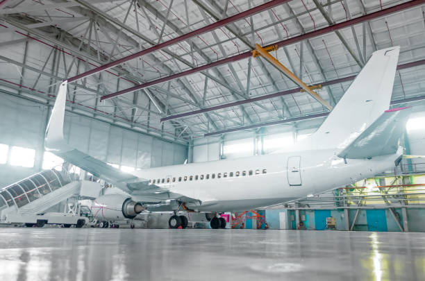 Airport hangar with coated flooring and structural surfaces protected by advanced aviation surface coatings