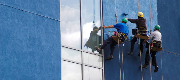 Professional painters working on a commercial exterior painting project