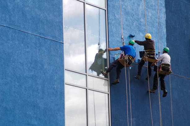 Professional painters working on a commercial exterior painting project