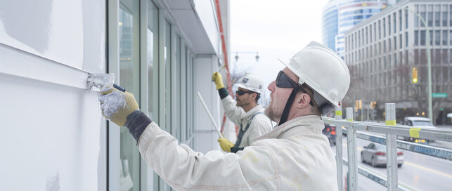 Professional working on commercial maintenance painting