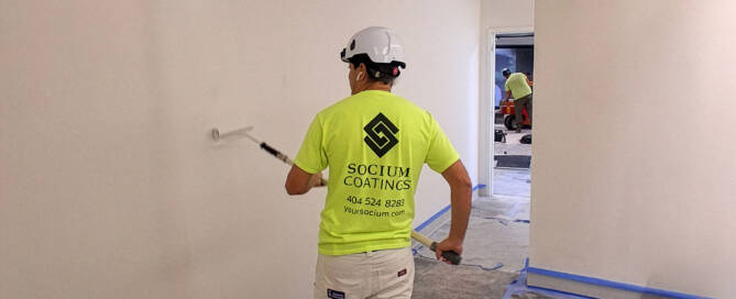 Professionals working on a commercial building painting project