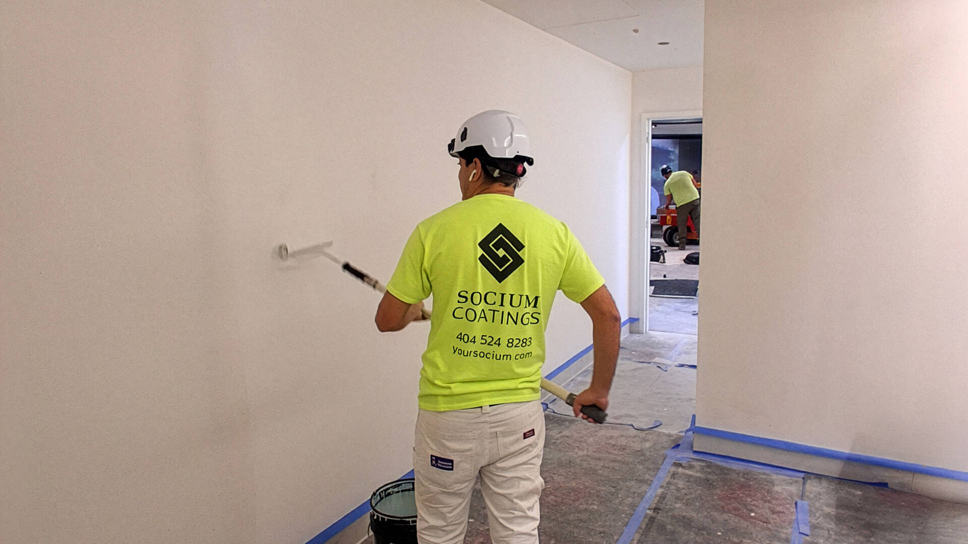 Professionals working on a commercial building painting project