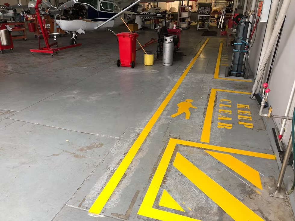 Safety markings in an aircraft hangar freshly painted