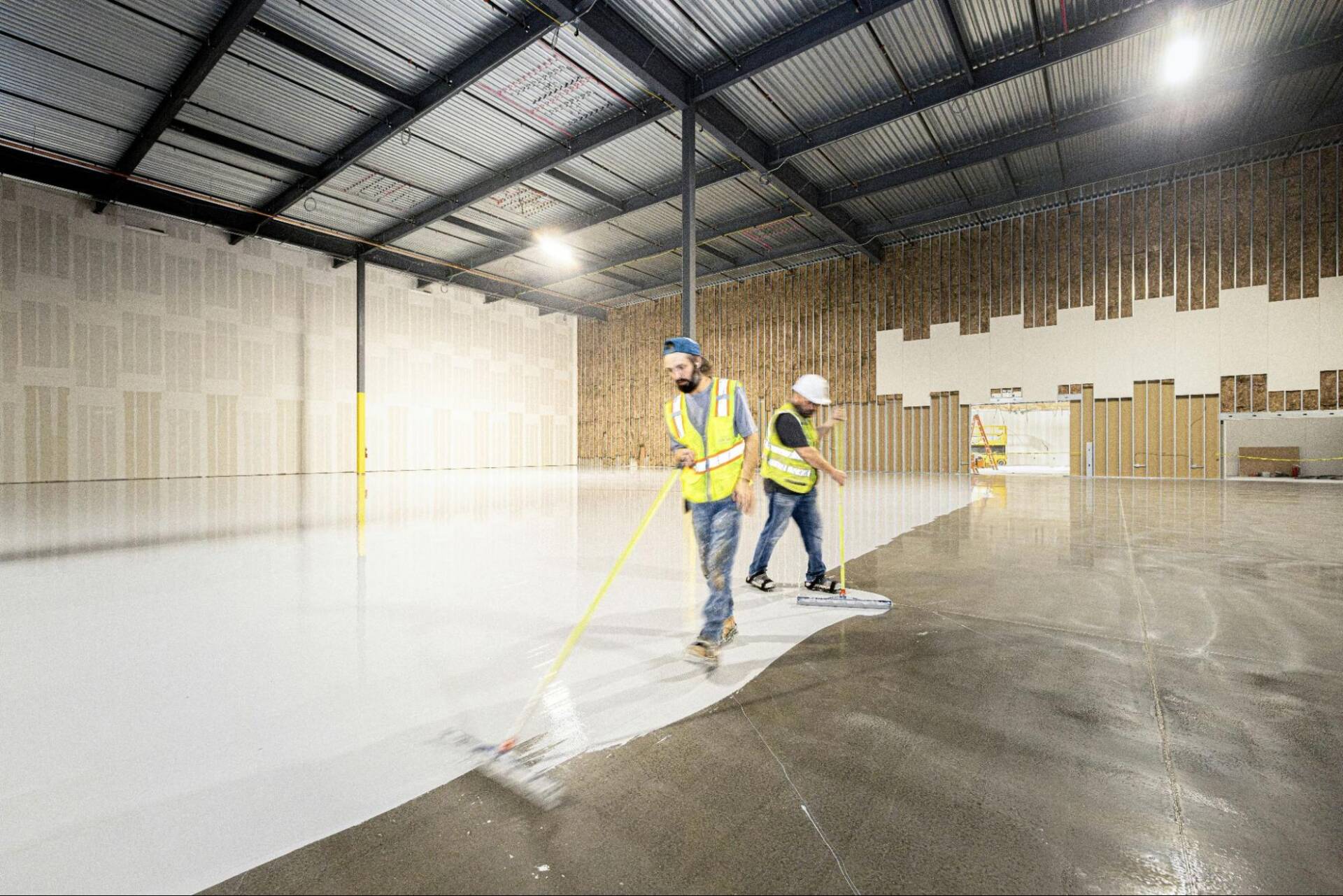 Durable commercial concrete coating system protecting warehouse floors from wear and damage