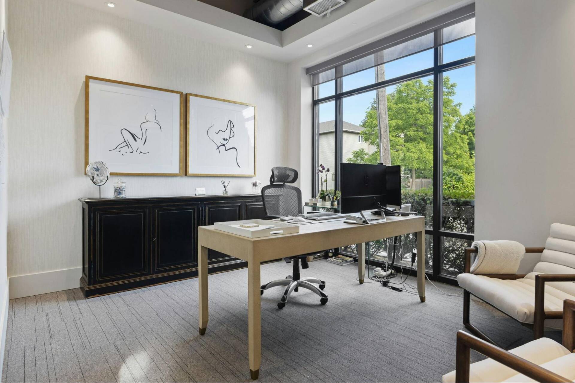 Professional office painters painting a conference room inside a commercial building