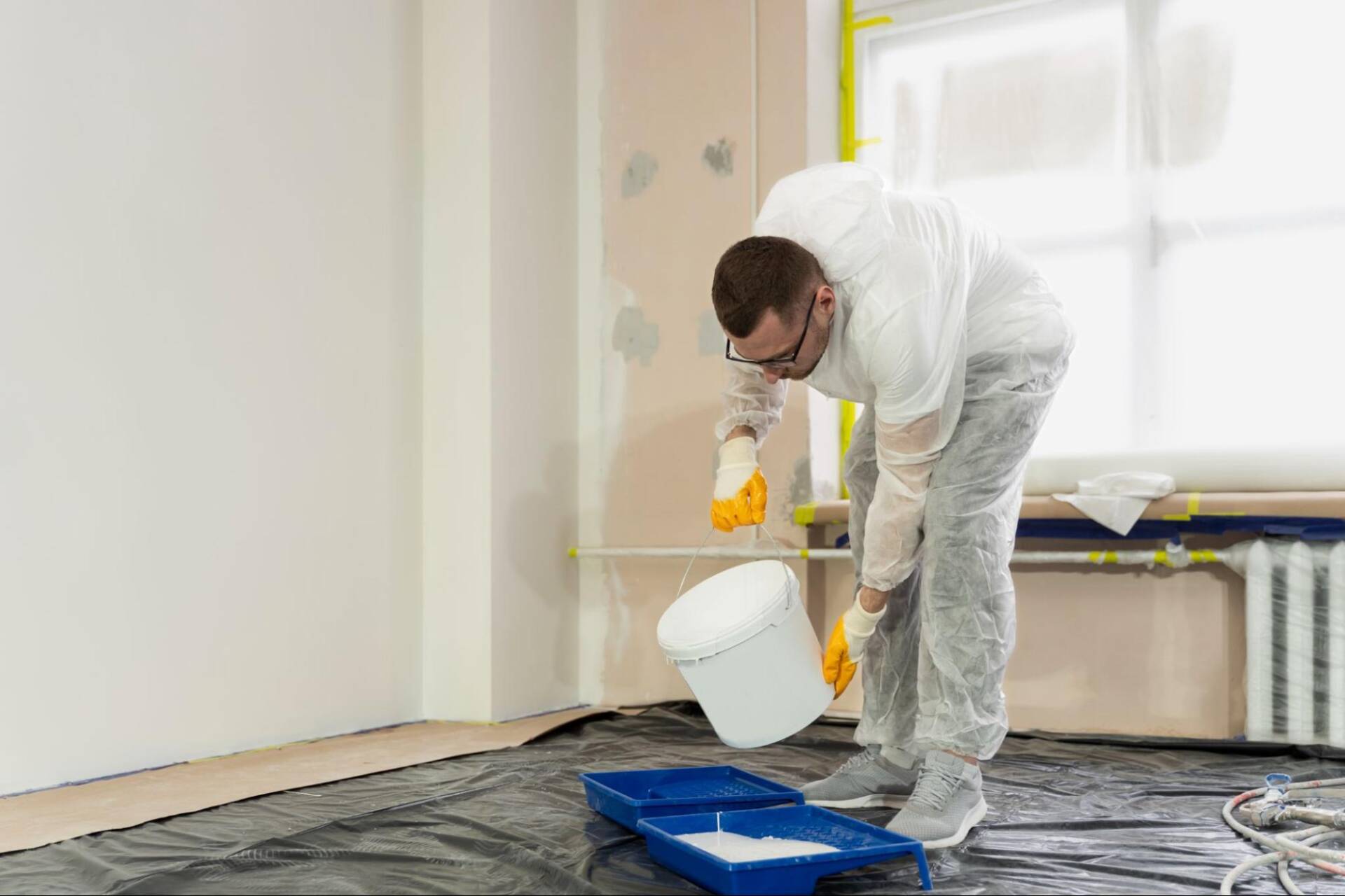 Government building interior painting preparation with commercial painters working in an active facility