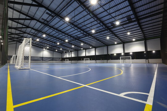 Spacious indoor sports facility with professionally painted walls and high ceilings